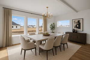 Dining space with baseboards, beamed ceiling, a notable chandelier, and wood finished floors