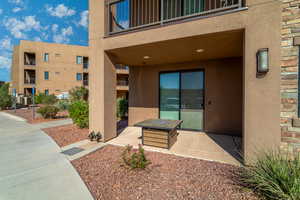 View of exterior entry with a balcony