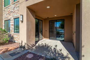 Property entrance with a patio