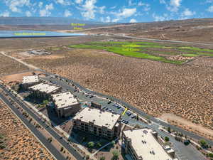 Birds eye view of property with a water and mountain view