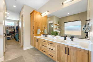 Bathroom with vanity and tile patterned flooring