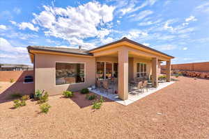 Back of property with a patio area