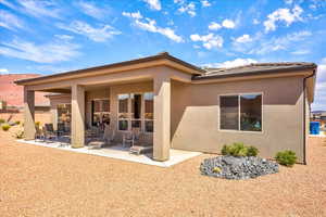 Rear view of house featuring a patio