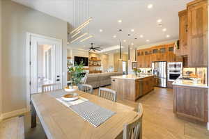 Dining space with sink and ceiling fan