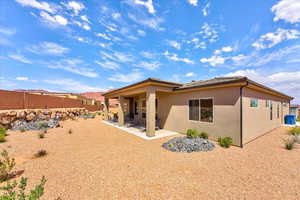 Rear view of property with a patio