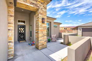 View of exterior entry featuring a garage