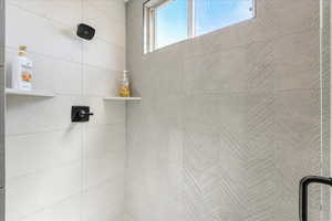 Interior details with a tile shower