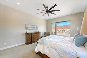 Carpeted bedroom with ceiling fan