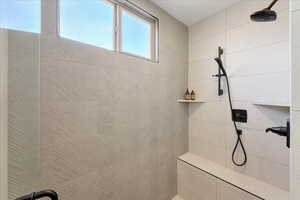 Bathroom featuring a tile shower