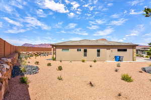 Rear view of property featuring a mountain view and a patio