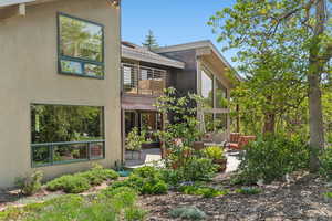 Rear view of house featuring a patio area and stucco siding