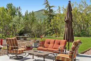 View of patio / terrace featuring a mountain view and an outdoor living space