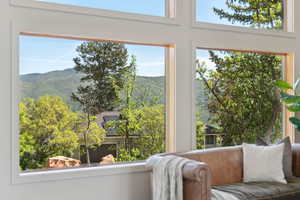 Sitting room featuring a mountain view and plenty of natural light