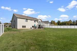 Back of property featuring a yard