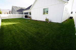 View of yard with central air condition unit and a patio area