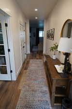 Hallway featuring dark hardwood / wood-style floors