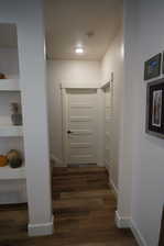 Corridor featuring dark hardwood / wood-style floors