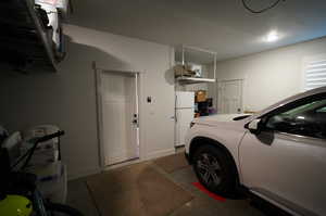 Garage with white fridge