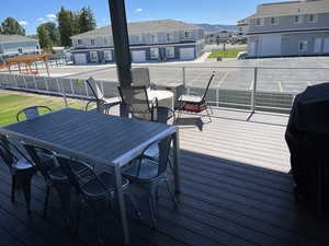 Wooden deck with a mountain view and a swimming pool