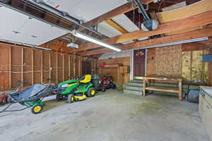 Garage with a workshop area and a garage door opener