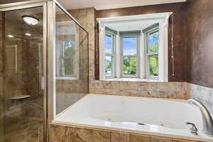 Bathroom with shower with separate bathtub