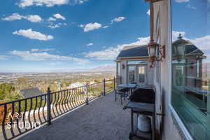 Balcony off of kitchen featuring  valley and mountain views