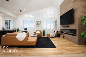 Living room featuring a large gas fireplace with colored ambient lighting, light hardwood / wood-style floors, vaulted ceiling, and a wealth of natural light