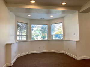 Empty room with carpet floors