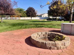 View of yard with an outdoor fire pit