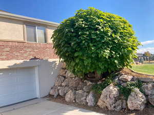 View of side of home with a garage