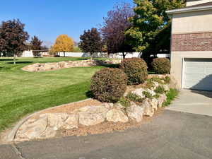 View of yard with a garage