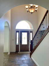 Foyer featuring a chandelier