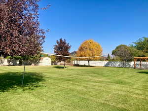 Surrounding community featuring a storage unit and a yard