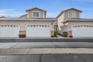 View of property featuring a garage