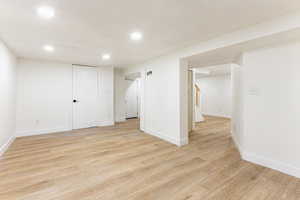 Basement featuring light hardwood / wood-style flooring