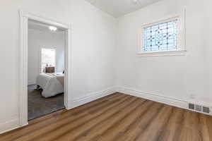 Bedroom featuring dark wood-type flooring