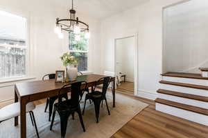 Dining room featuring a chandelier and hardwood / wood-style flooring