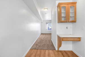 Hallway featuring light hardwood / wood-style flooring