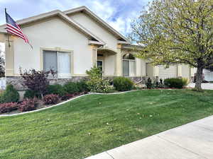 View of front of property featuring beautiful landscaping