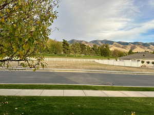 View of lot that is available for purchase with property that gives great views