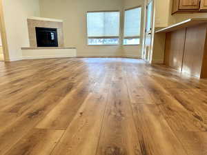 Great room featuring recently updated flooring and a gas fireplace