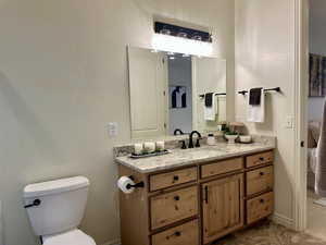 Primary Bathroom with vanity and toilet