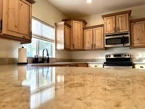 Beautiful new granite adorns the kitchen