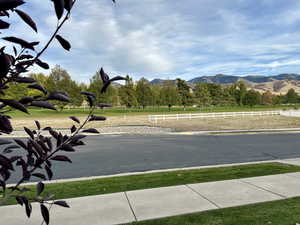 View of lot available, golf course and mountains