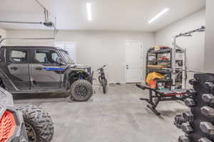 Garage featuring a garage door opener