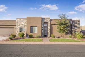 Southwest-style home with a garage