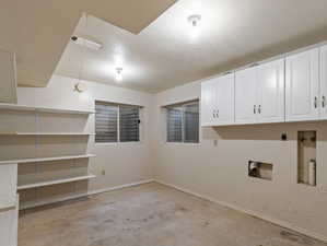 Basement featuring a textured ceiling