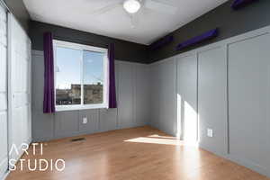 Spare room with ceiling fan and light hardwood / wood-style floors