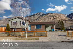 View of front of home featuring a mountain view