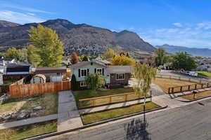 Exterior space with a mountain view and a front yard